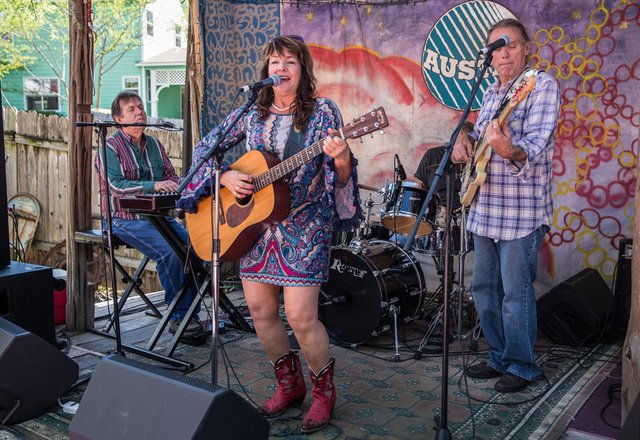 Leeann Atherton singing with her band at the Full Moon Barn Dance in Austin, Texas