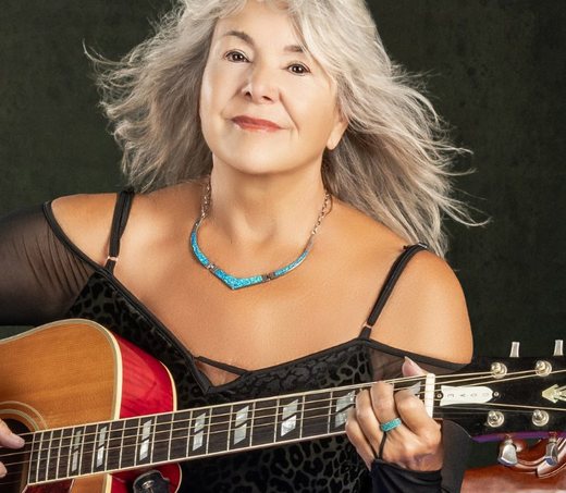 Leeann Atherton with her acoustic guitar